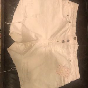Free People distressed white denim shorts